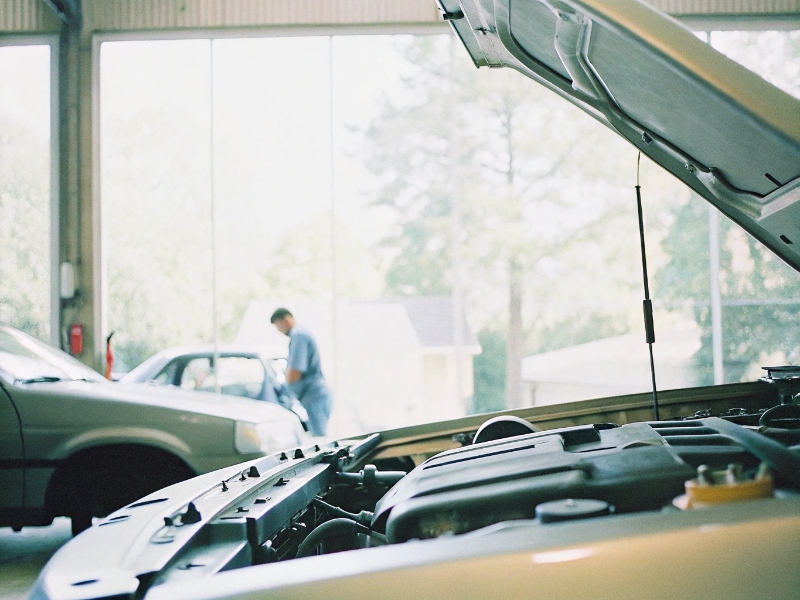 Experienced mechanic working on engine repair