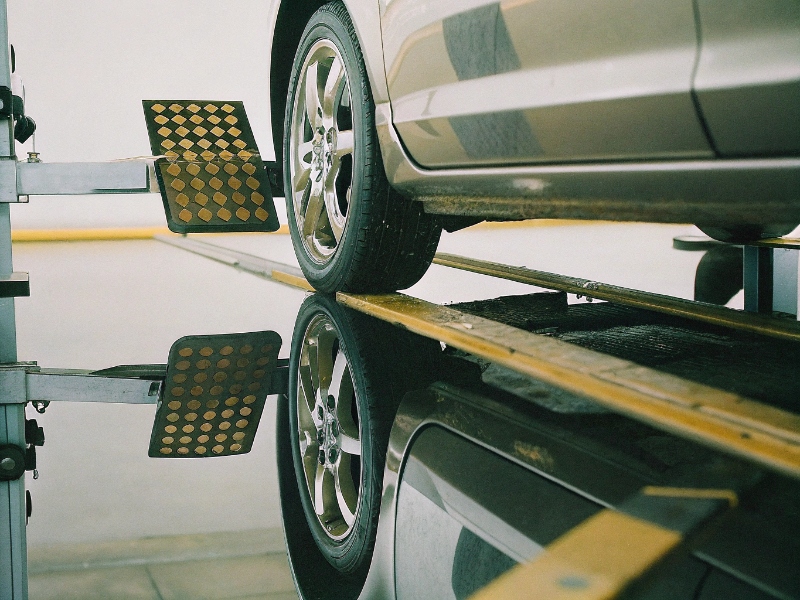 Precision wheel alignment machine at quality auto tire and repair shop